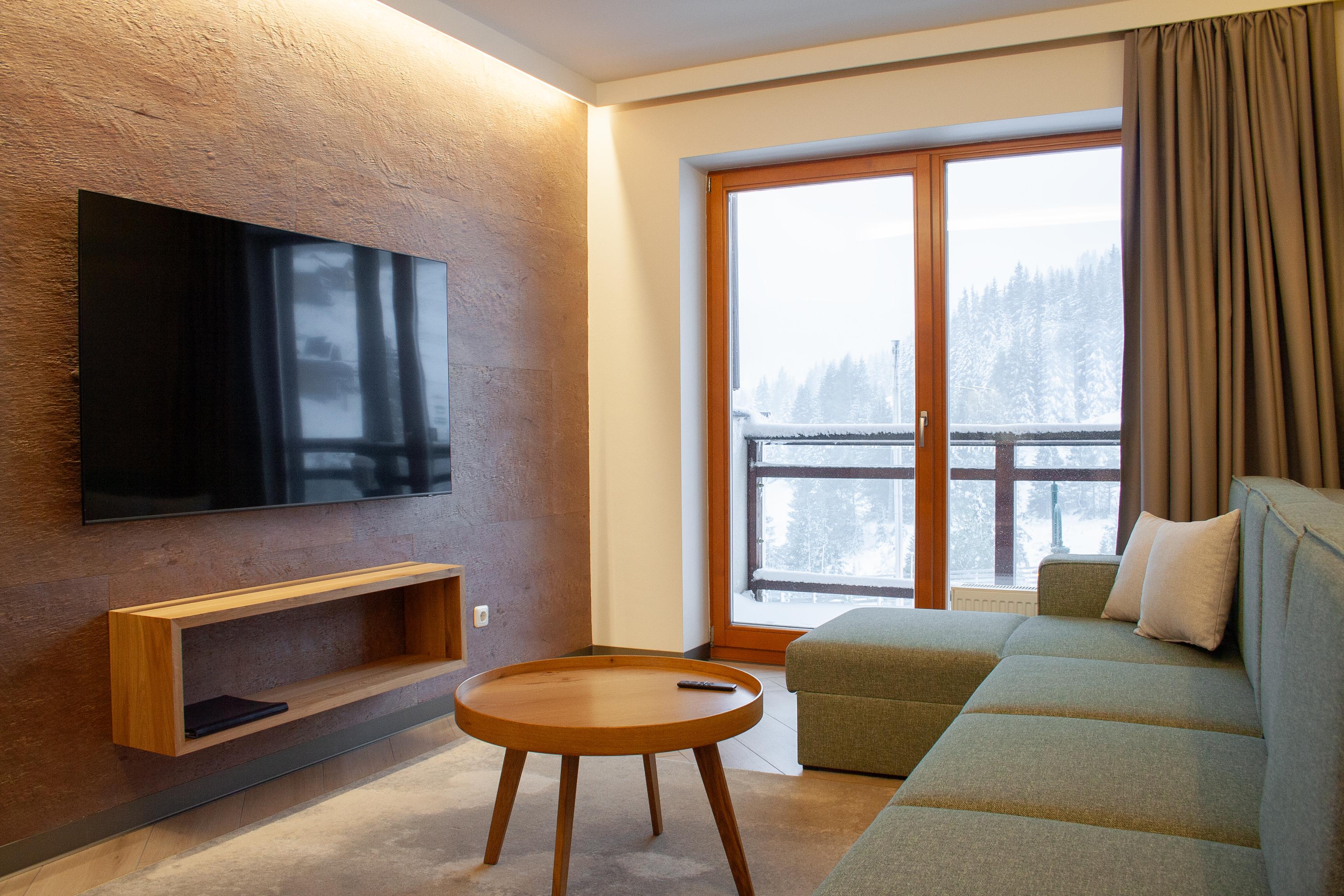 The living room of the SissiPark apartment, furnished with modern furniture.